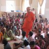 Swamiji amidst children during a class